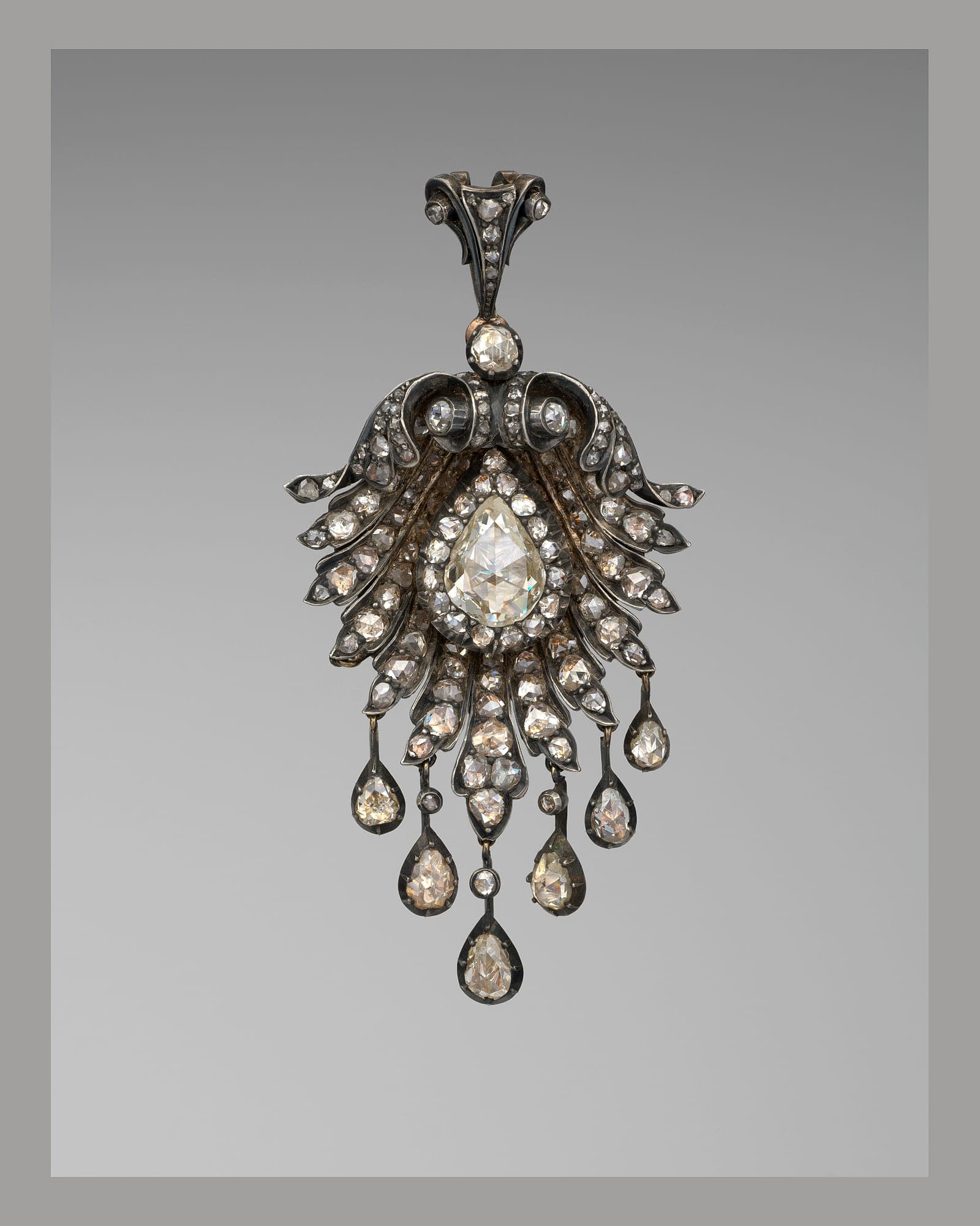 Diamond girandole pendant with drop stones, grey background