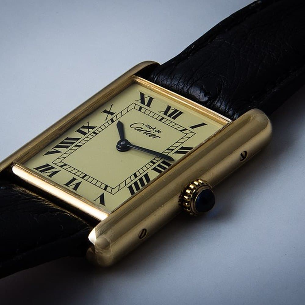 Cartier Tank in gold on a black leather strap