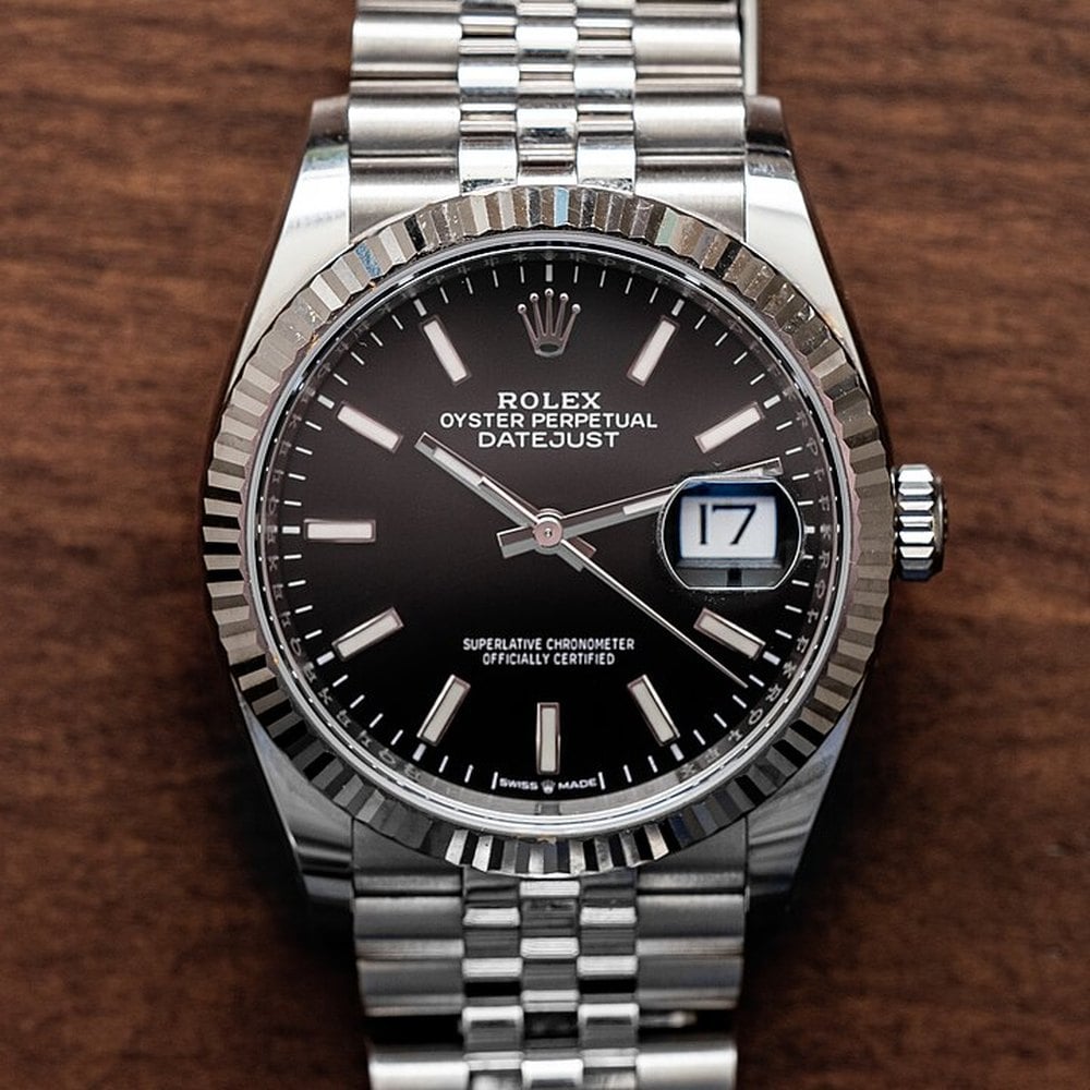 Rolex Datejust with a black dial, fluted bezel and Jubilee bracelet
